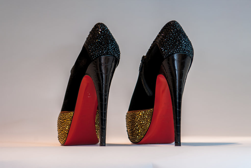 Black Louboutins with shiny details